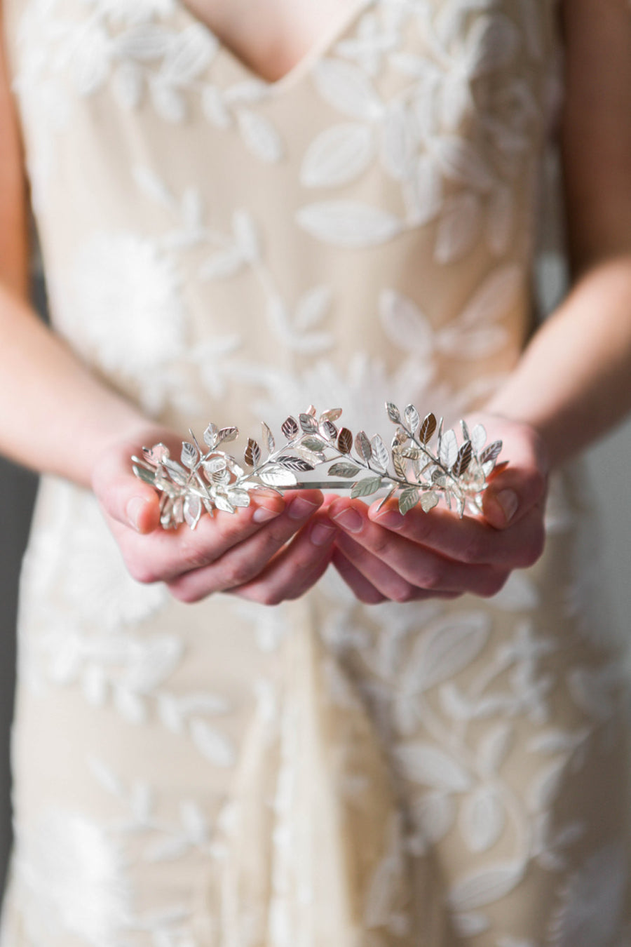 Bride wearing a silver laurel leaf tiara