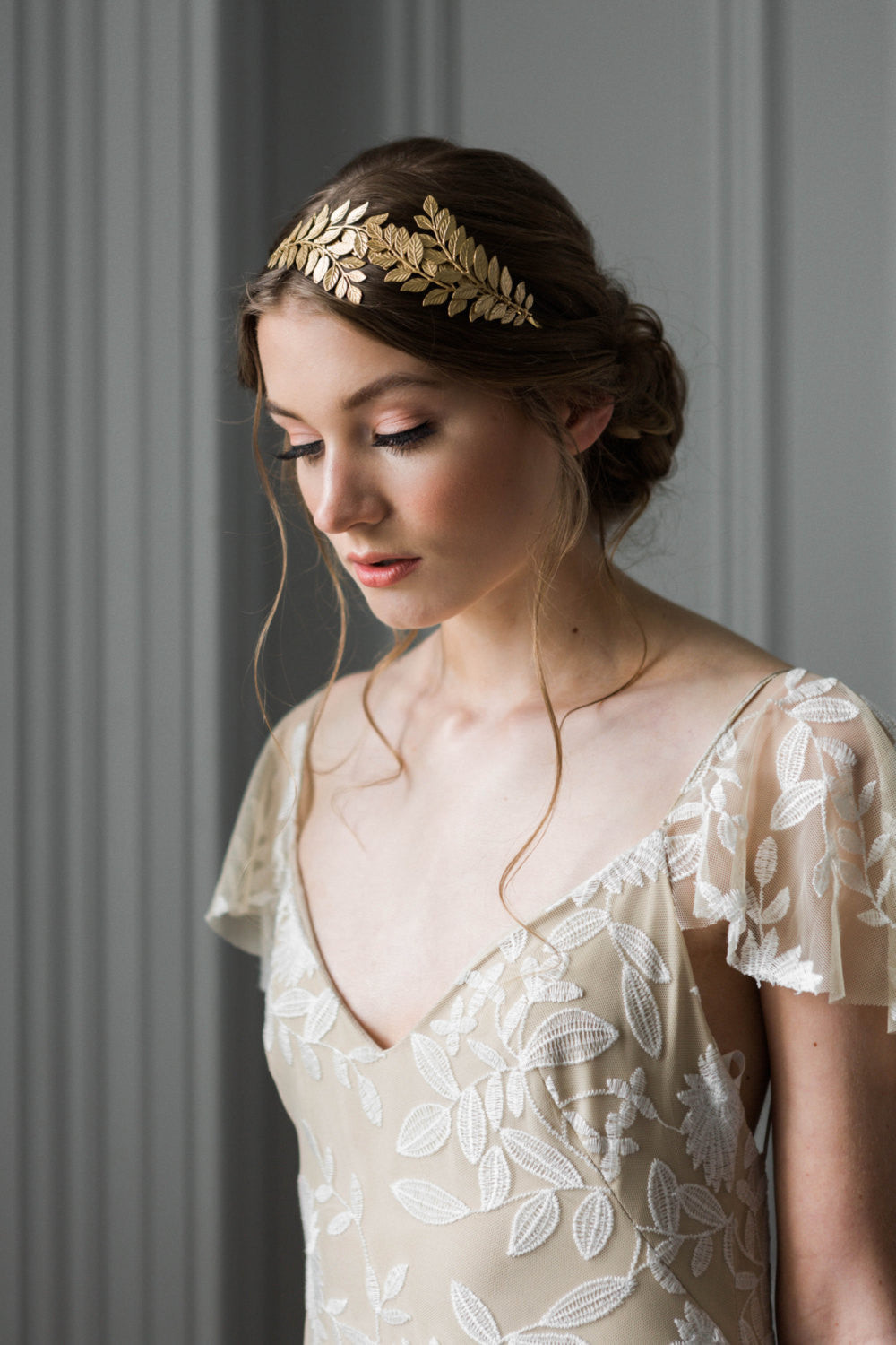 Bride wearing a gold leaf headpiece