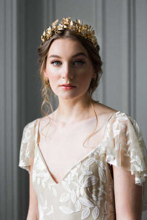 Bride wearing a gold laurel leaf flower crown
