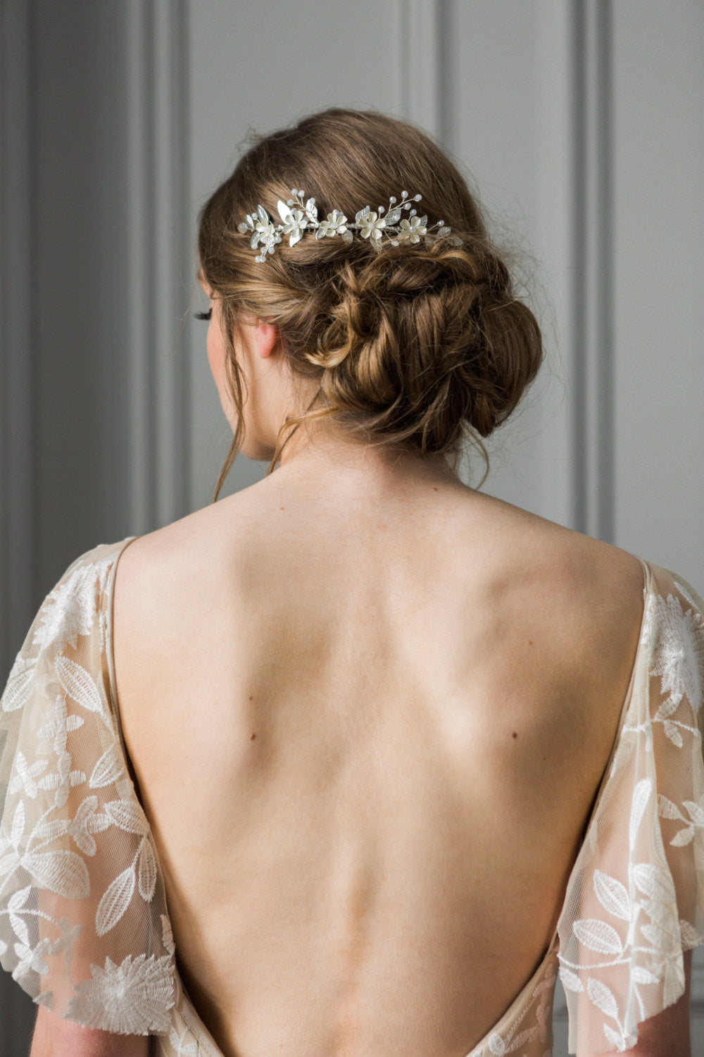 Bride wearing a crystal and flower hair comb