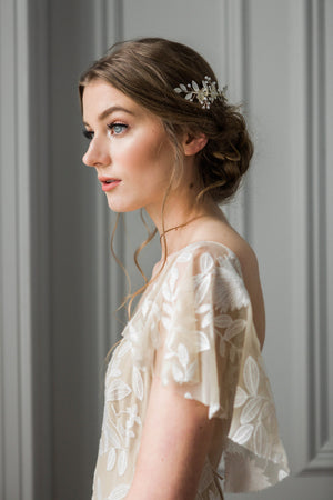 Bride wearing a silver and crystal bridal hair comb.
