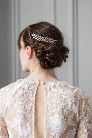 A bride wearing a silver edwardian leaf hair comb