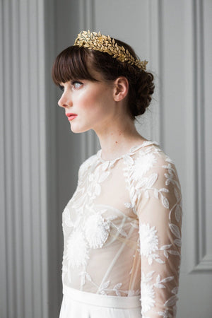 Bride wearing a gold leaf bridal crown