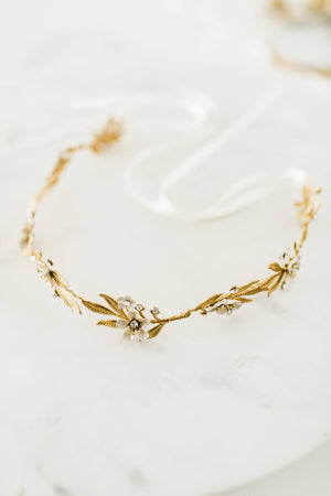 Close up of gold halo bridal tiara