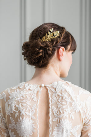 Bride wearing a gold leaf tiara in her hair