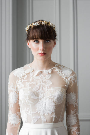 Model wearing a gold leaf bridal crown tiara