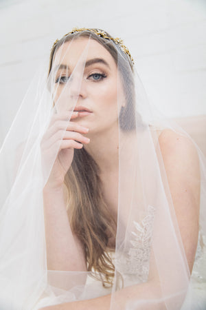 Bride in a wedding dress wearing a classic bridal veil