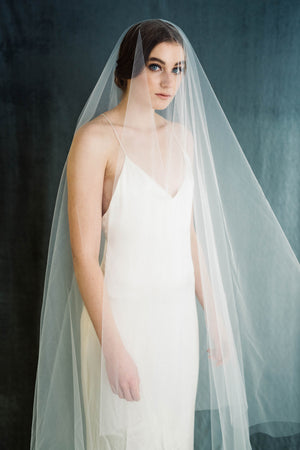 Bride in wedding dress wearing a classic bridal veil