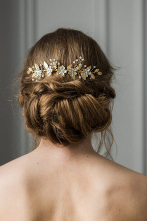 Bride wearing a gold leaf and crystal bridal hair comb.