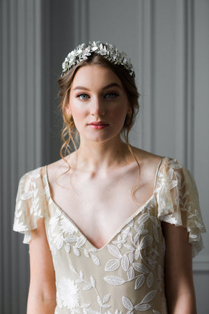 Bride wearing a silver laurel leaf flower crown