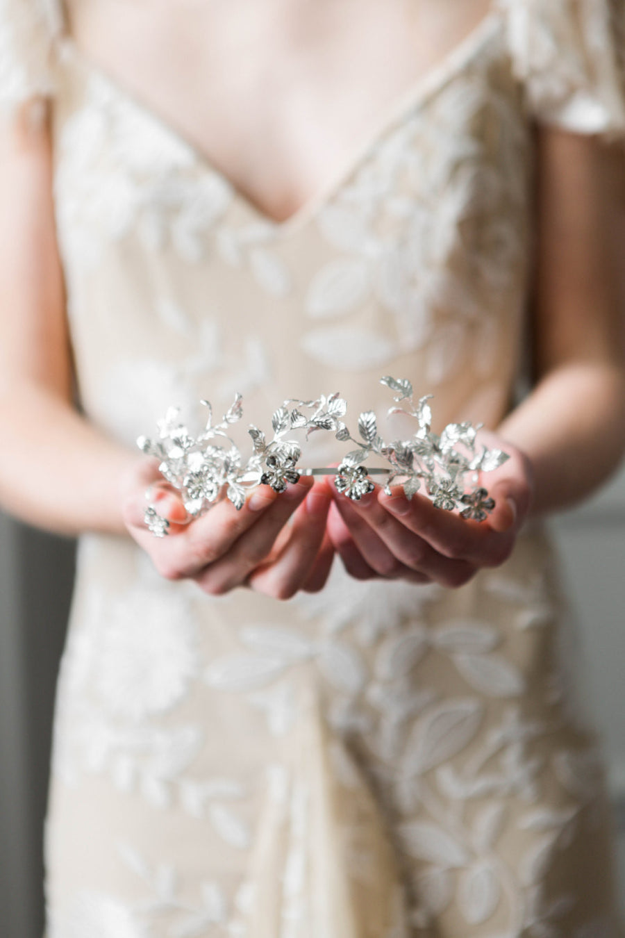 Bride wearing a silver headpice made replica antique myrtle leaves