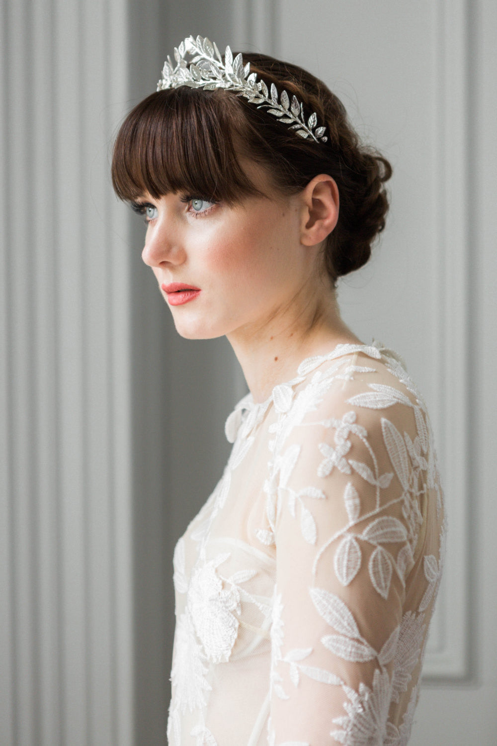 Bride wearing a silver leaf flower crown