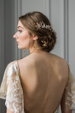 Bride wearing gold and crystal bridal hair comb
