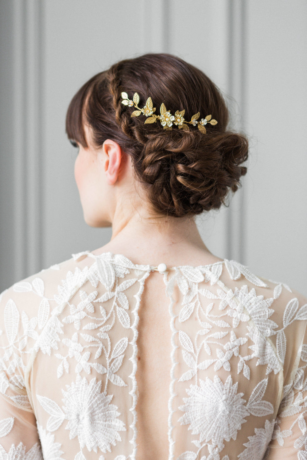 Bride wearing a gold leaf bridal comb in her hair