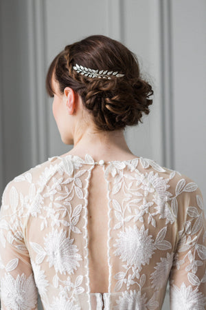A bride wearing a silver leaf edwardian hair comb