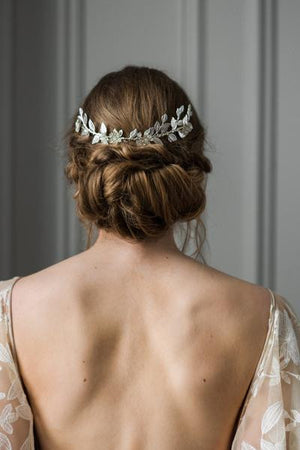 Bride wearing bridal headpiece made of silver vines