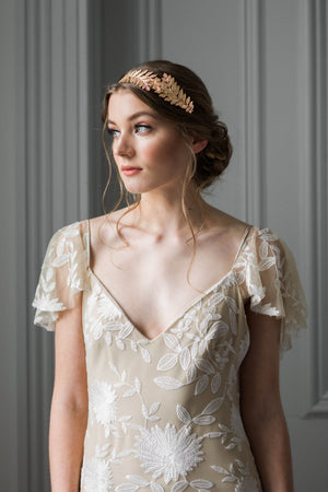 Bride wearing a gold leaf headband