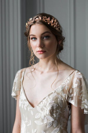 Bride wearing a delicate rose gold leaf tiara
