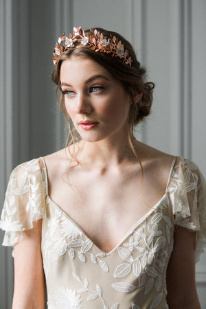 Bride wearing a rose gold laurel leaf flower crown