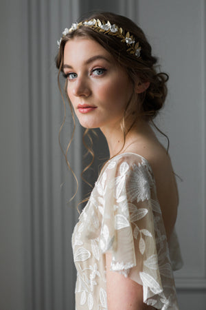 Bride wearing a gold crown with silk flowers