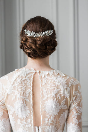Bride wearing a silver laurel leaf comb in her hair