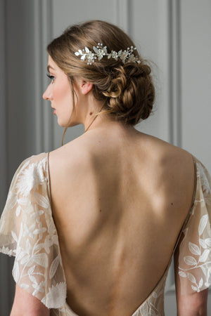 Bride wearing a silver leaf and crystal bridal hair comb.