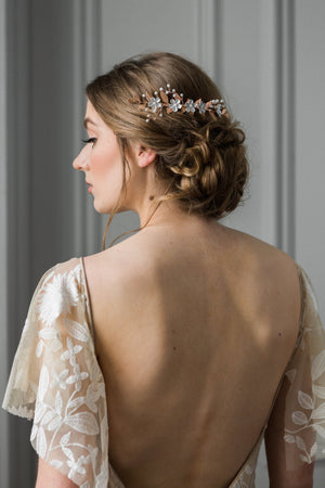 Bride wearing gold and crystal bridal hair comb