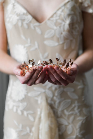 Bride wearing a delicate gold leaf tiara