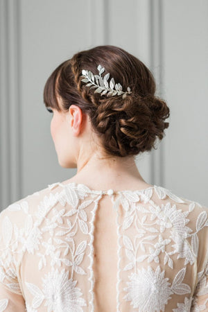 Bride wearing a silver leaf comb in her hair