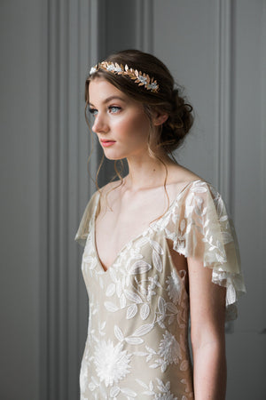 Bride wearing a rose gold crown with silk flowers