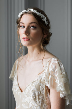 Bride wearing a silver crown with silk flowers