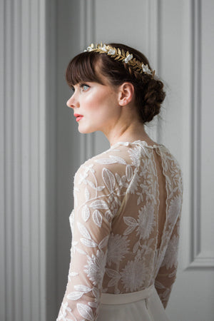 Model wearing a gold leaf bridal crown tiara