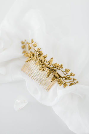 Close up of a hair comb headpiece made of gold leaves