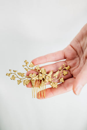 Close up of a bridal headpiece made of gold leaves and flowers