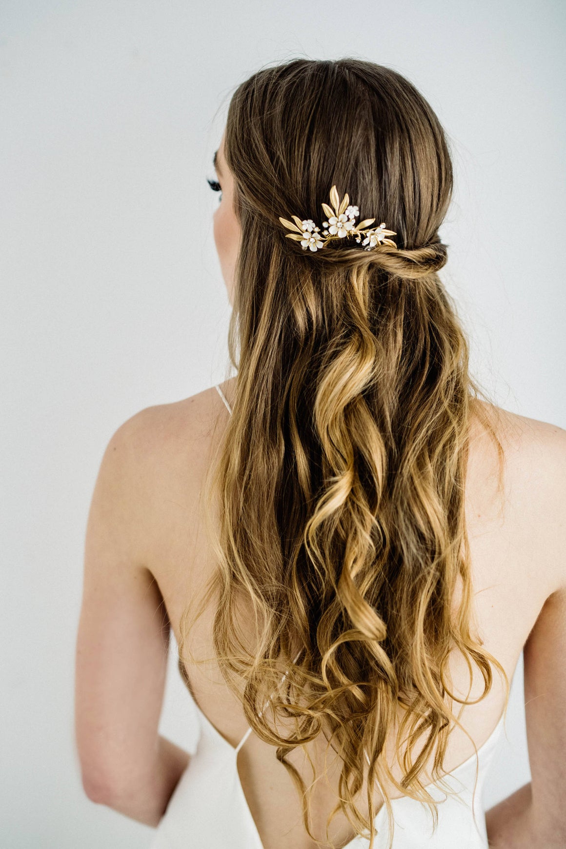Bride wearing a hair pin tiara in back of hair