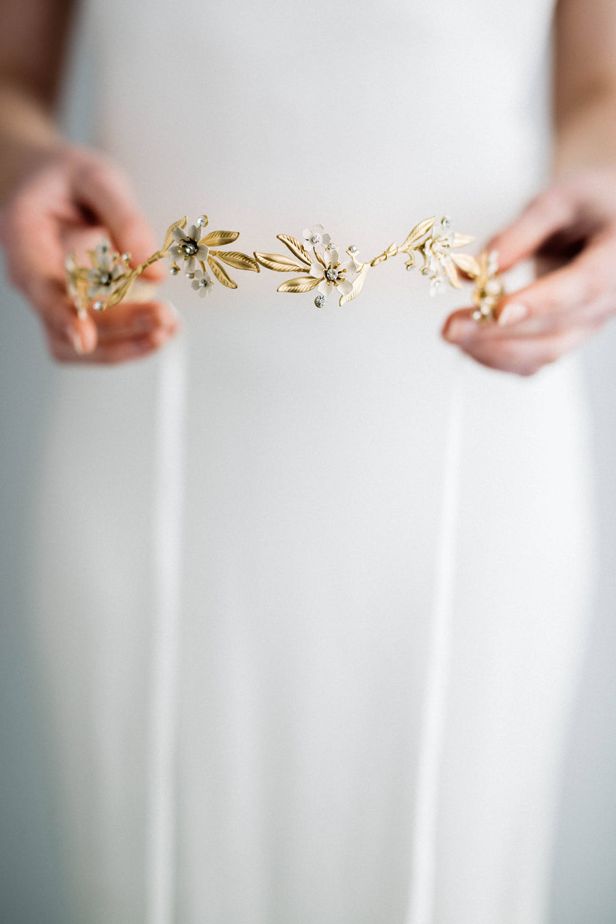 Bride wearing a gold tiara under a veil