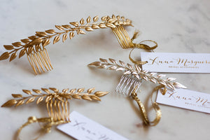 A close up of three edwardian leaf hair combs