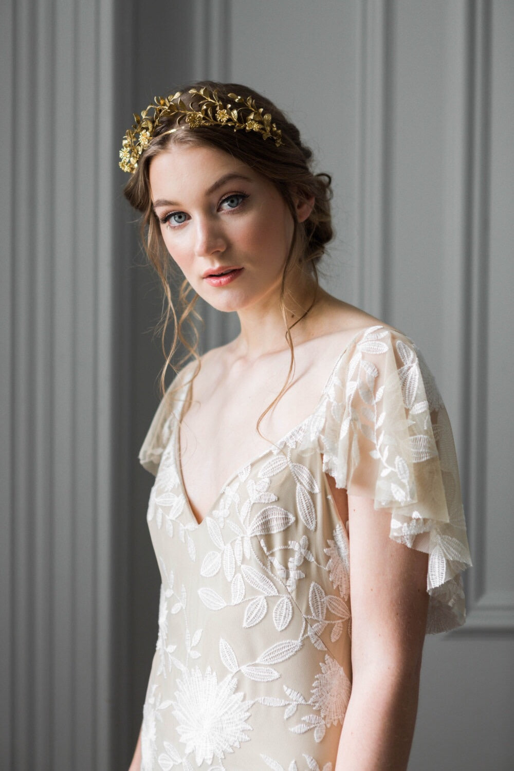 Bride wearing a gold headpiece made of replica anitque myrtle leaves