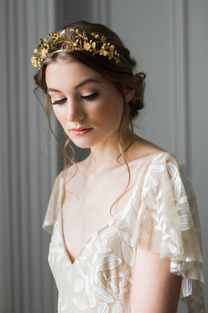 Bride wearing a gold headpiece made of replica anitque myrtle leaves