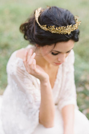 Bride wearing a gold leaf bridal crown